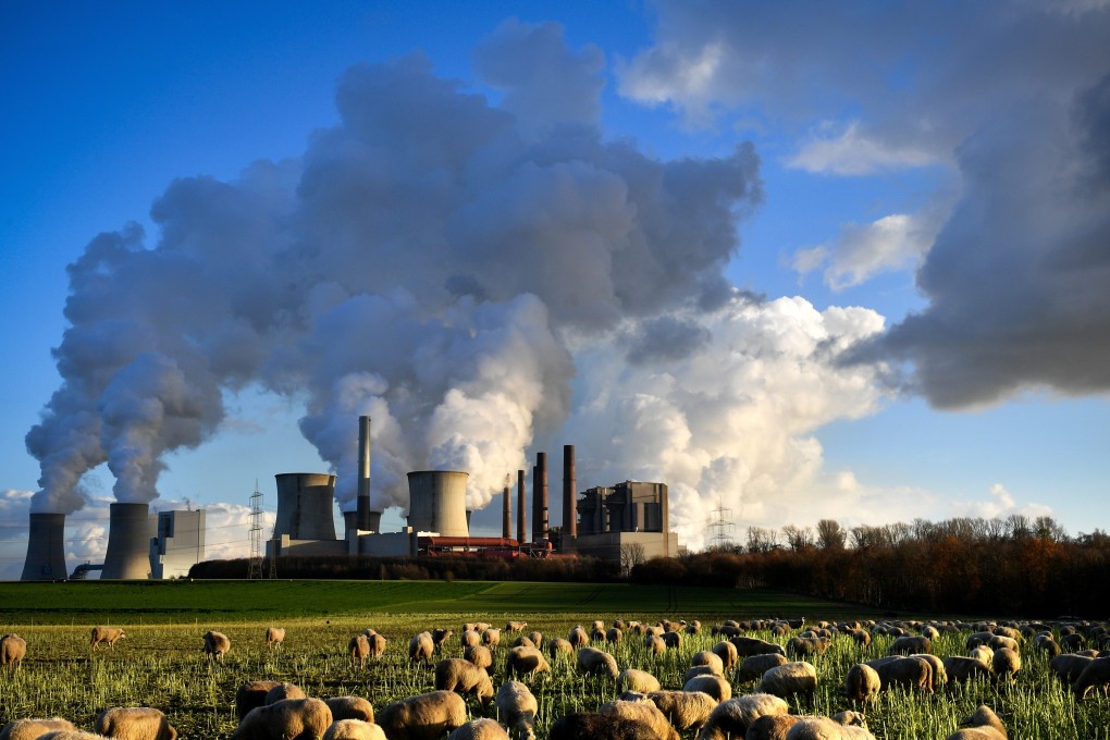 Steam rises from a lignite-fired power plant in Bergheim, Germany. The Rhenish Brown Coal Field is Europe’s largest carbon dioxide source. Photo: EPA-EFE