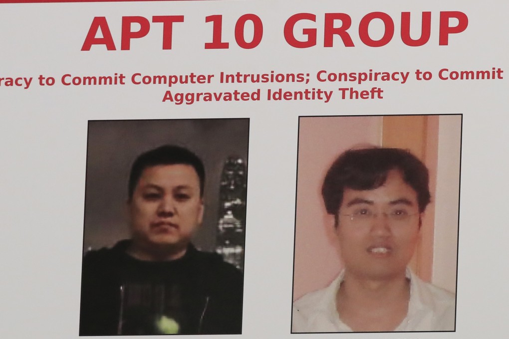 A poster displayed during a news conference at the Department of Justice in Washington, showing two Chinese citizens suspected to be with the group APT 10. Japan criticised China for cyberattacks. Photo: AP