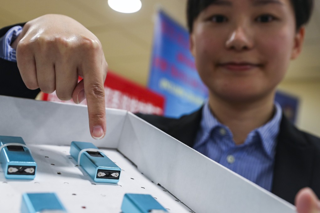 Detective inspector Annie Cheng with some of the restricted items seized from passengers at Hong Kong International Airport. Photo: Winson Wong