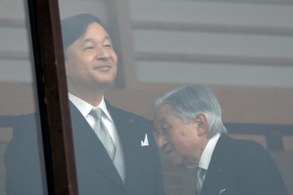 Japan's Emperor Akihito walks behind Crown Prince Naruhito after greeting well-wishers in Tokyo. Photo: Reuters