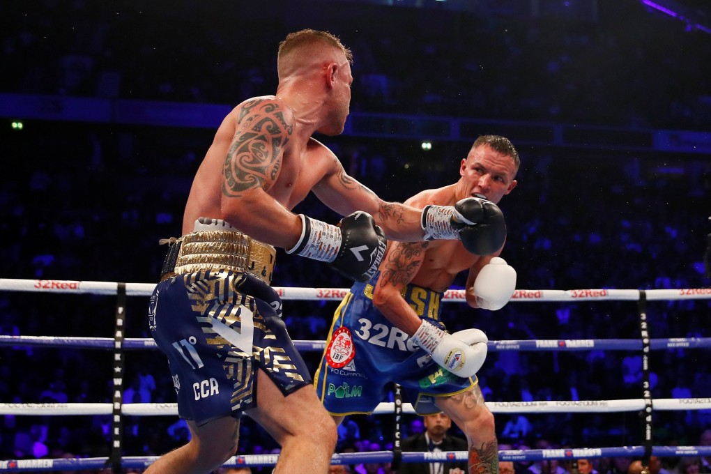 Josh Warrington and Carl Frampton go toe-to-toe for the IBF world featherweight title at Manchester Arena. Photo: Reuters