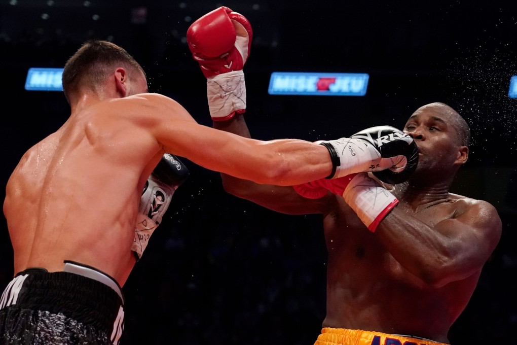 Oleksandr Gvozdyk lands a right hand on Adonis Stevenson during their WBC light-heavyweight championship fight in Quebec City. Photo: AFP