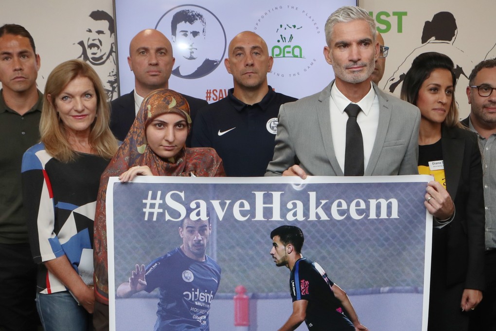 Craig Foster (centre) with supporters for the Save Hakeem campaign. Photo: EPA