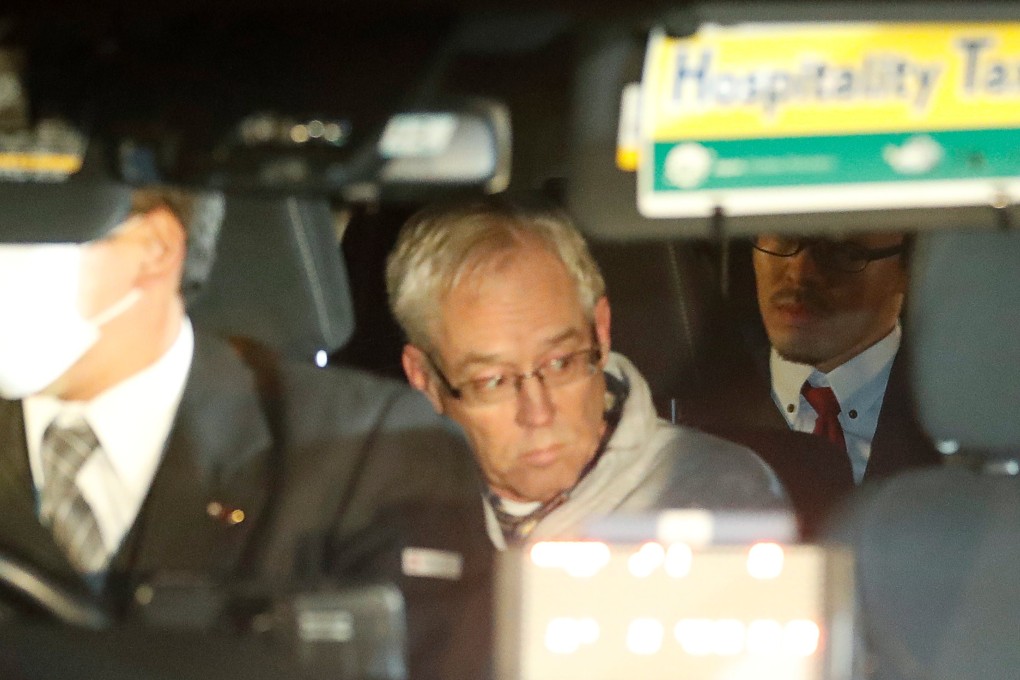 Greg Kelly, the former deputy of ousted Nissan chairman Carlos Ghosn, is seen in a car as he leaves a detention centre in Tokyo after being released on bail. Photo: Reuters