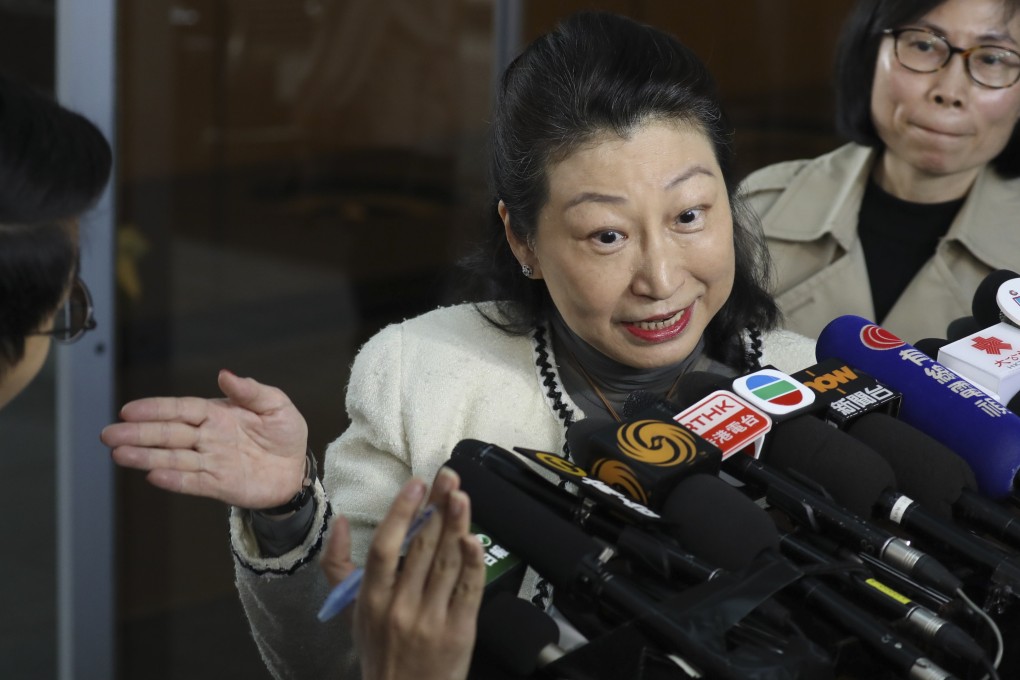 Secretary for Justice Teresa Cheng addresses the press at the airport after returning from a trip. Photo: Dickson Lee