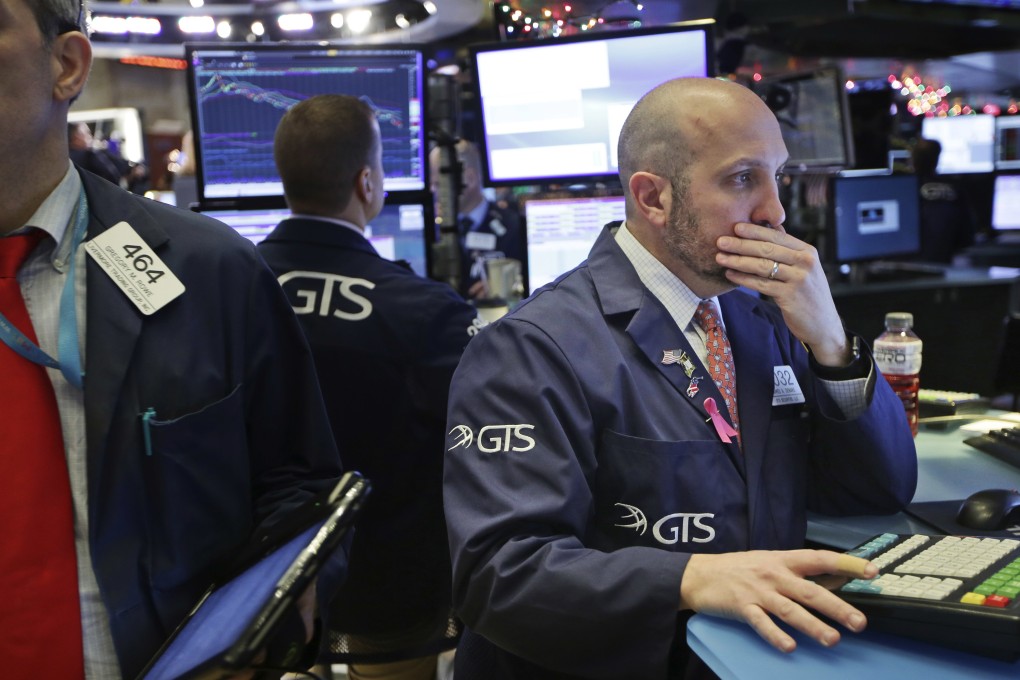 Traders work on the floor of the New York Stock Exchange on Monday, December 24, 2018, when the largest losses ever on a Christmas Eve were posted. Photo: Associated Press