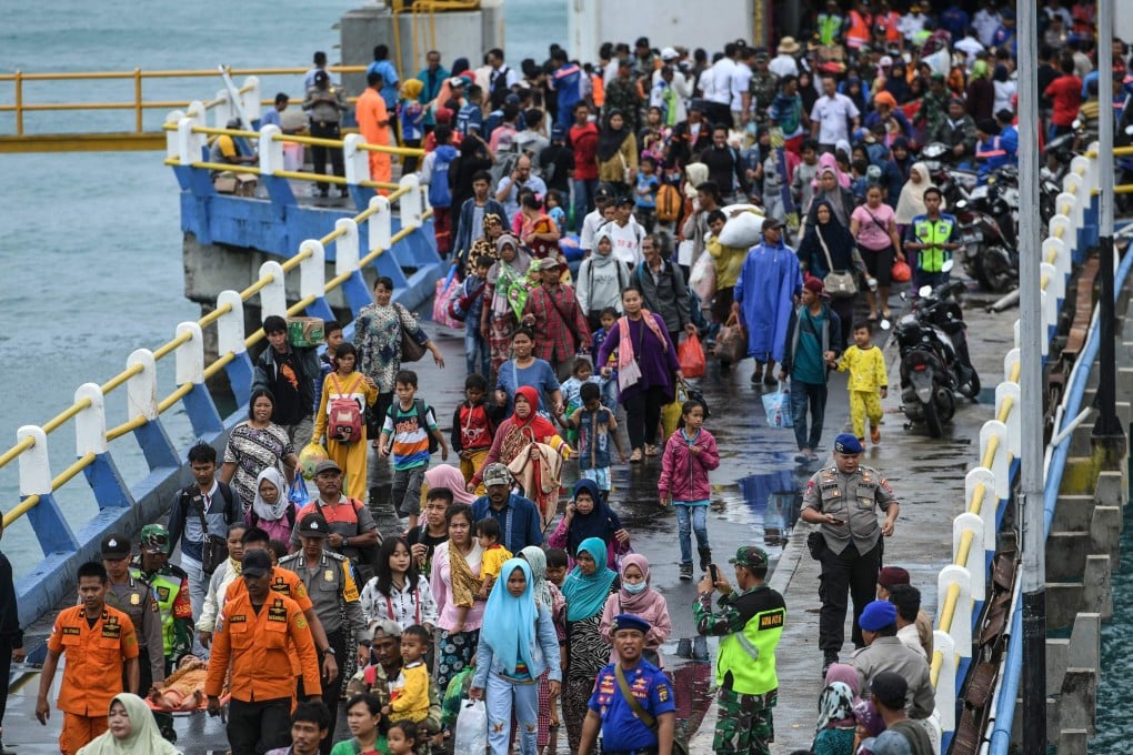 Residents disembark from a ferry after being evacuated from Sebesi island, in Bakauheni, Lampung province on Wednesday. Photo: AFP