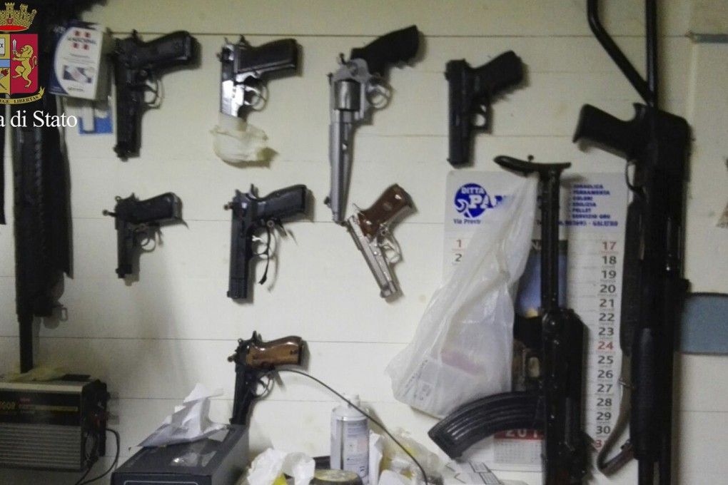 Weapons hang on the wall of an ‘Ndrangheta hideout in southern Calabria associated with the Crea crime family, in this 2016 Italian police photo. Photo: AP