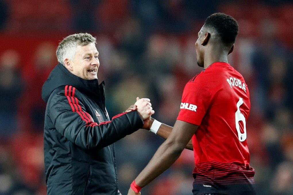 Ole Gunnar Solskjaer celebrates with Paul Pogba after Manchester United’s win against Huddersfield. Photo: Reuters