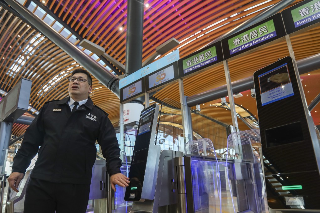 Raymond Lok, assistant director of information systems at Hong Kong Immigration demonstrates how to use the new e-channel at the customs checkpoint of the Hong Kong-Macau-Zhuhai Bridge. Photo: Xiaomei Chen