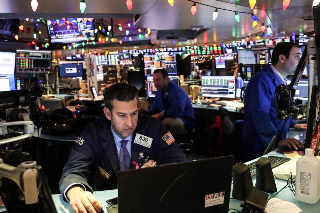 Traders work on the floor of the New York Stock Exchange on Wednesday. Photo: Reuters