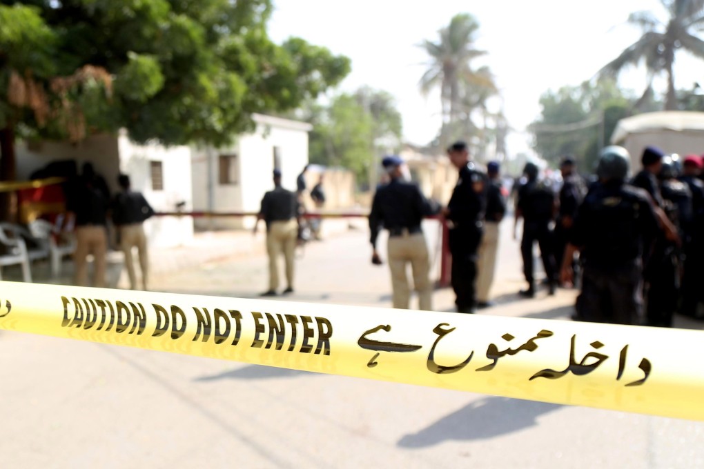 Pakistan security officials at the scene of the attack on the consulate in Karachi. Photo: EPA-EFE