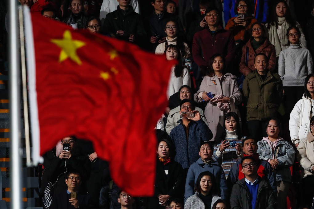 Spectators at the opening ceremony of a FINA swimming competition in Hangzhou, China, stand while the national anthem is played. Photo: EPA-EFE