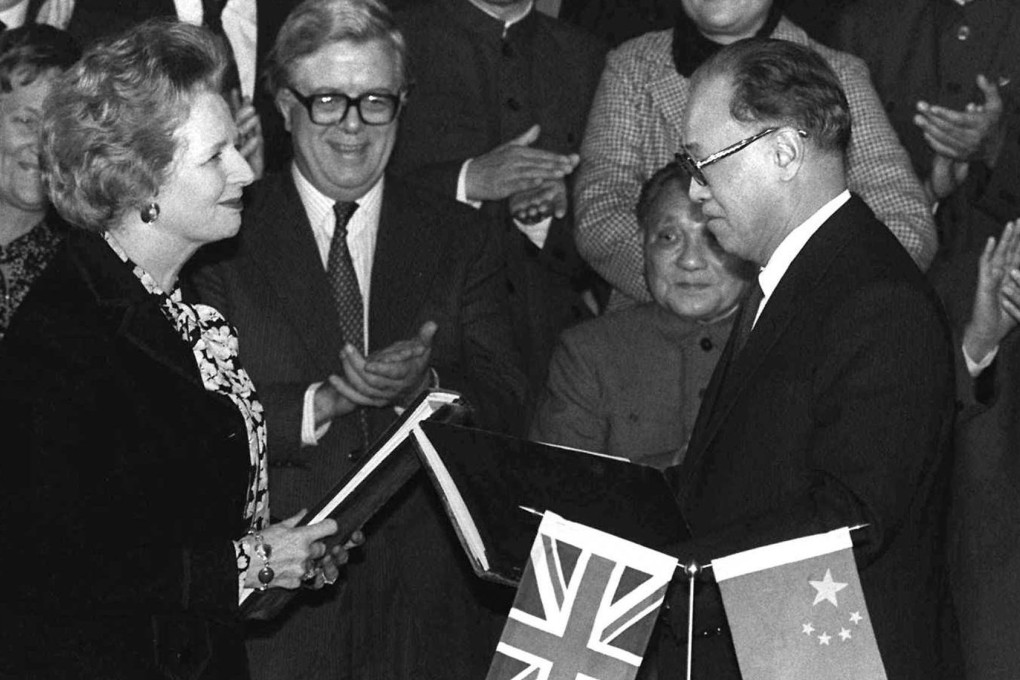 British Prime Minister Margaret Thatcher (front left) and Chinese Premier Zhao Ziyang (front right) exchange signed copies of the Hong Kong handover agreement to China in Beijing on December 19, 1984. Photo: AP