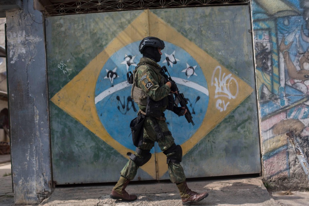 File photo of a soldier on patrol in the violence-plagued favela of Vila Kennedy in Rio de Janeiro, Brazil. Photo: AFP