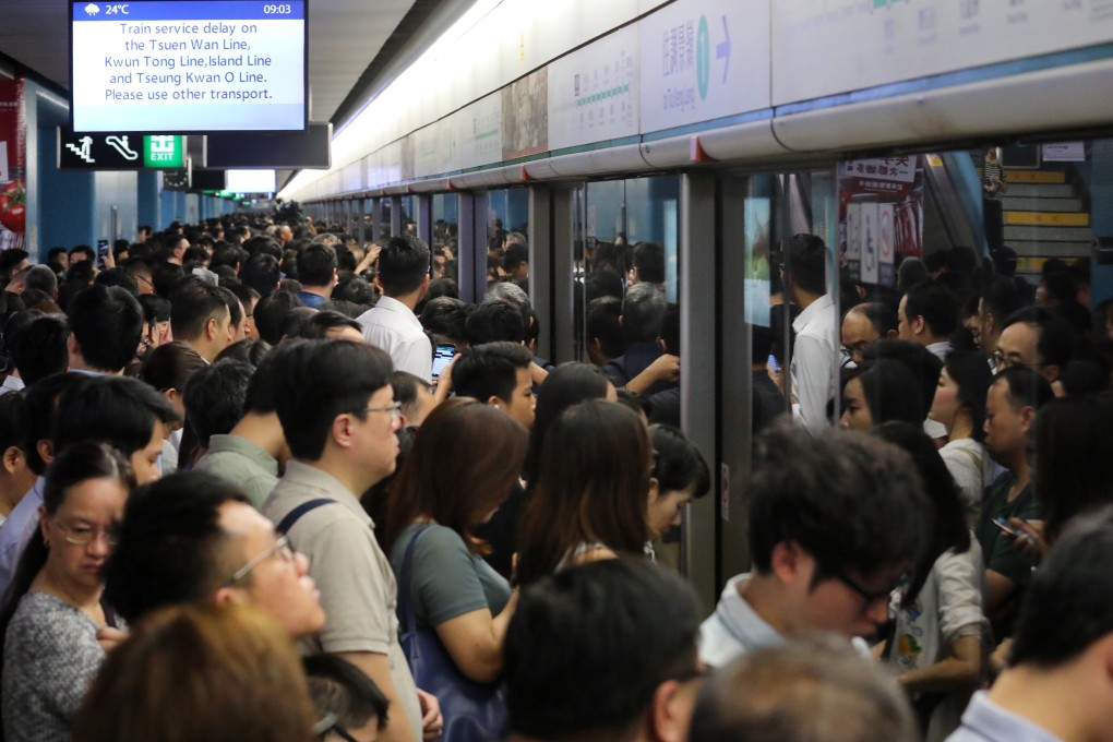 Commuters crowd onto the platform at the Kowloon Tong MTR station after a signalling fault caused a six-hour disruption to services on . But why the tendency to replicate the crowds elsewhere in the city? Photo: Felix Wong