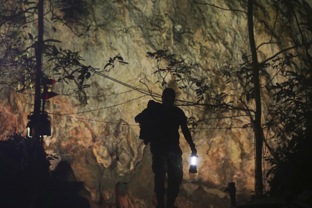 A rescuer makes his way down to the cave complex in Mae Sai, northern Thailand. Photo: AP