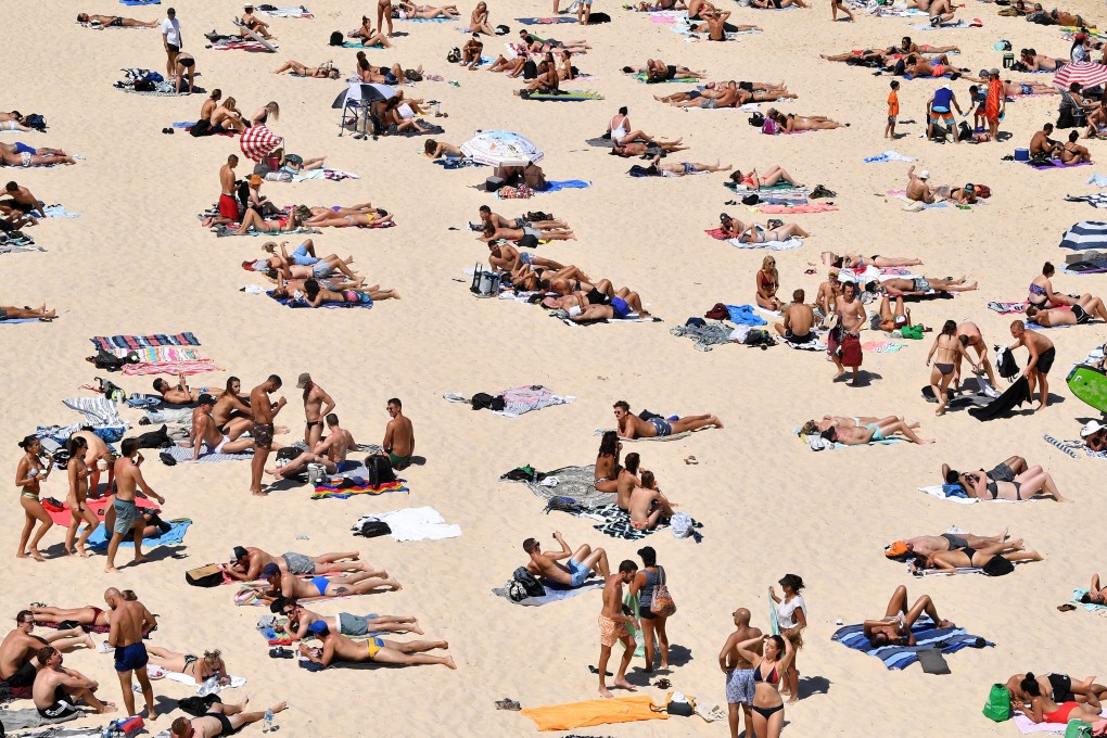 Beachgoers sunbathe at Bondi Beach in Sydney, Australia on Friday. Photo: EPA