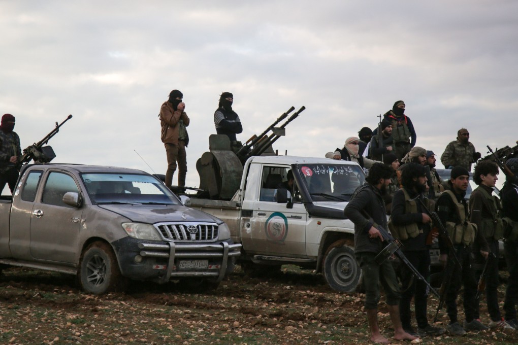 Turkish-backed Syrian fighters gather with their vehicles at a position near the northern Syrian town of Manbij on Friday. Photo: AFP