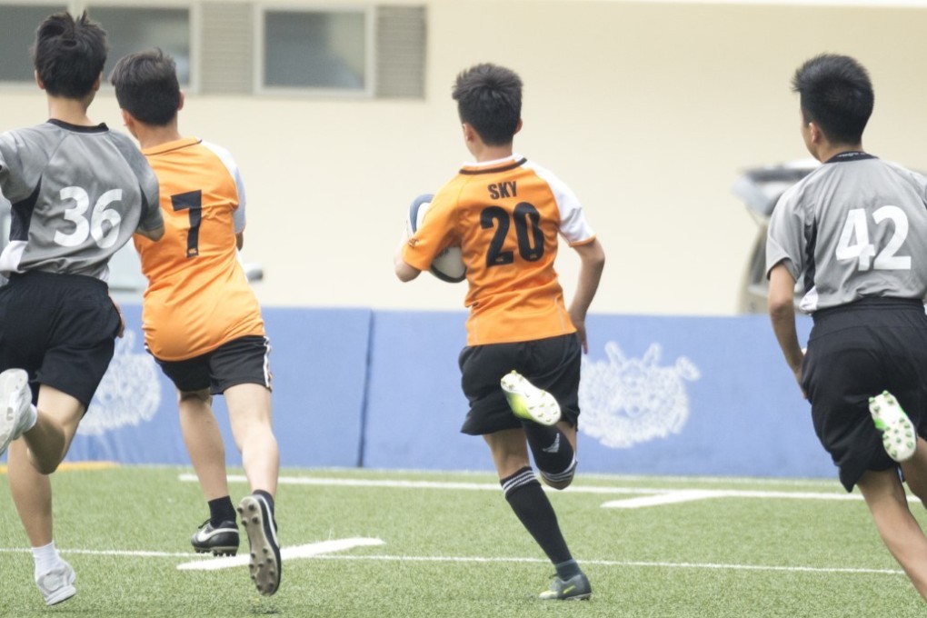 Youngsters play rugby at the Tin Shui Wai Sports Ground. Photo: HKRU