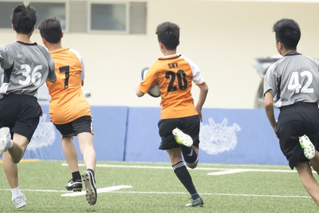 Youngsters play rugby at the Tin Shui Wai Sports Ground. Photo: HKRU