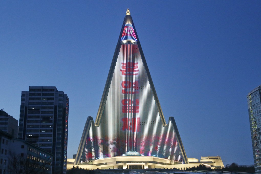 A propaganda message is displayed on the facade of the pyramid-shaped Ryugyong Hotel in Pyongyang. Photo: AP
