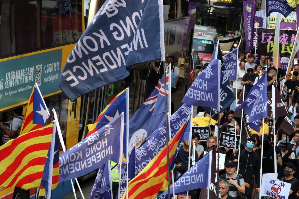 Protesters march with independence banners at a National Day rally on October 1. Photo: Felix Wong