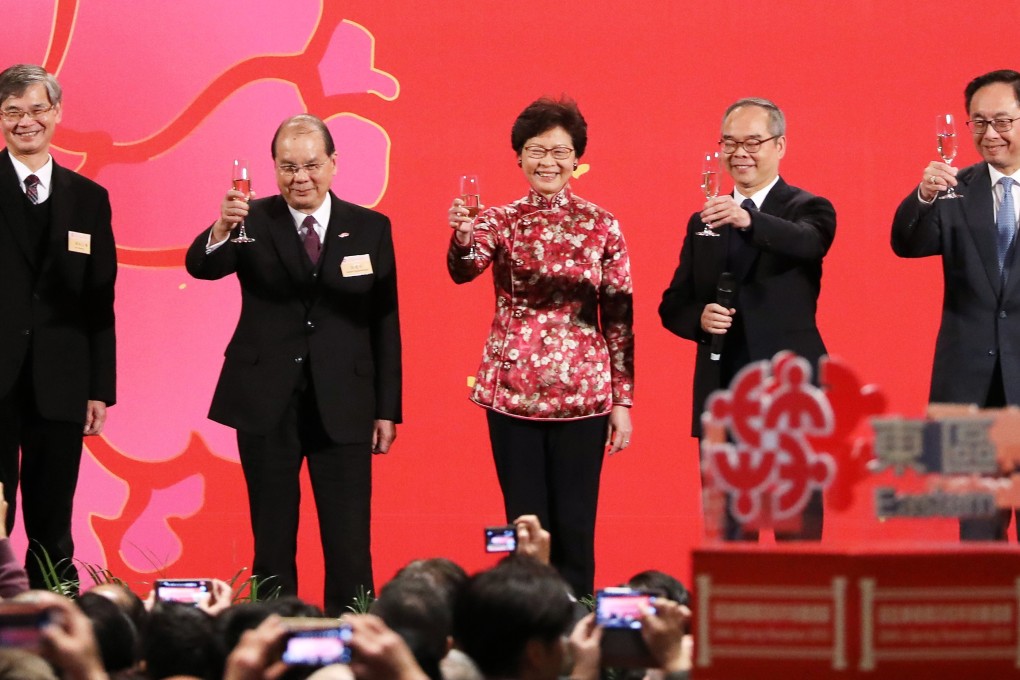 Hong Kong Chief Executive Carrie Lam and her ministers, including (from left) Secretary for Labour and Welfare Law Chi-kwong, Chief Secretary Matthew Cheung, Secretary for Home Affairs Lau Kong-wah and Secretary for Innovation and Technology Nicholas Yang, attend a Lunar New Year reception on February 23. Photo: Sam Tsang
