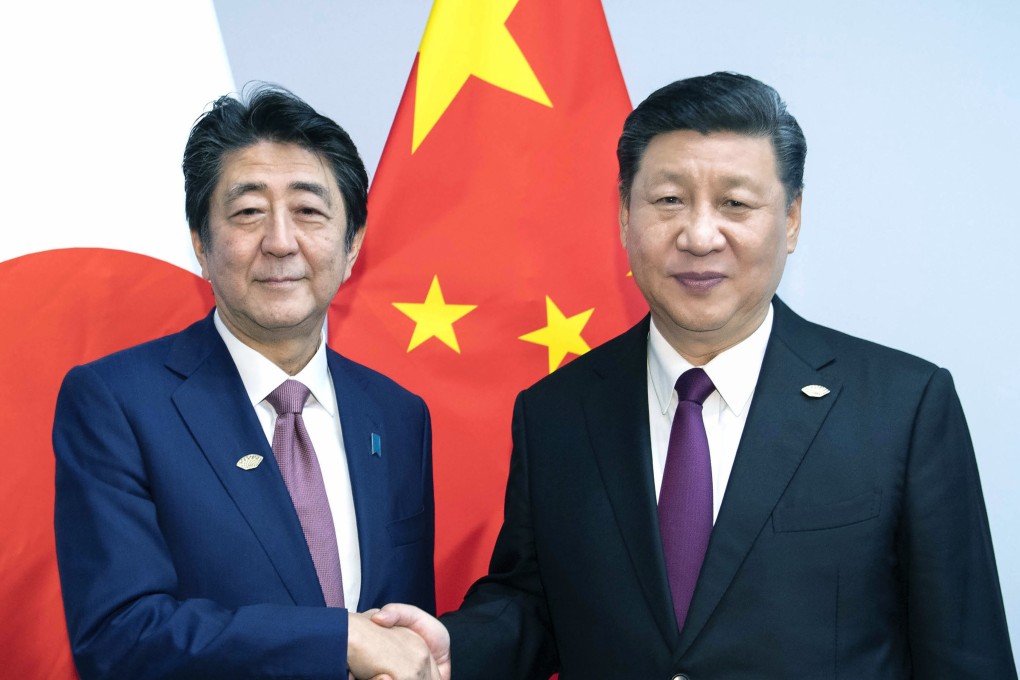 Planned high-level economic talks in Beijing follow a meeting in October between (left) Japanese Prime Minister Shinzo Abe and Chinese President Xi Jinping. Photo: Xinhua