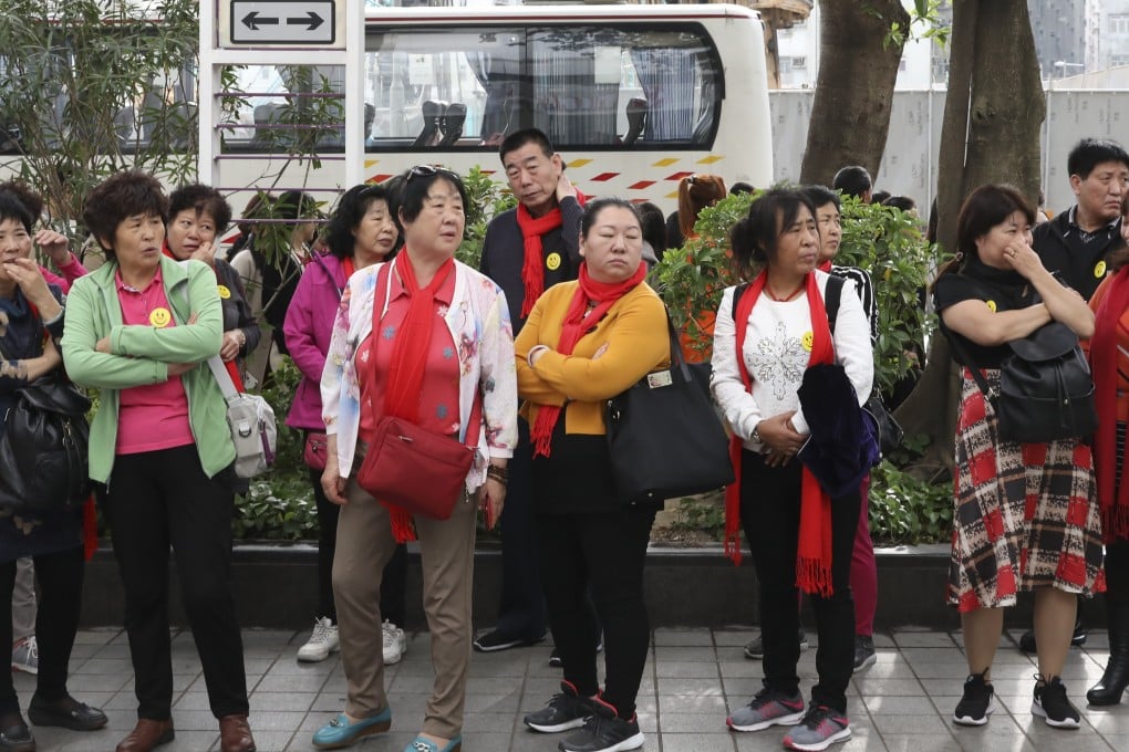 Mainland visitors crowd a pavement in the residential district of To Kwa Wan, on December 18. Photo: Nora Tam