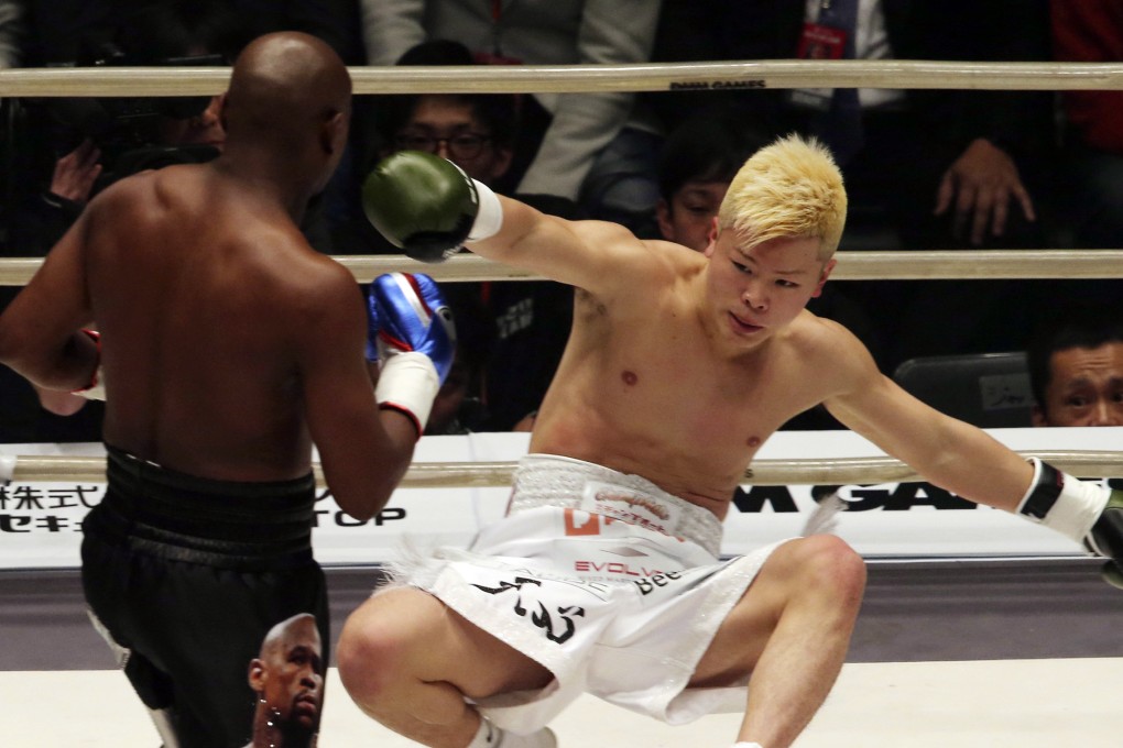Japanese kick-boxer Tenshin Nasukawa is on his way to the canvas after being hit by Floyd Mayweather Jnr in their exhibition fight in Saitama. Photo: AP
