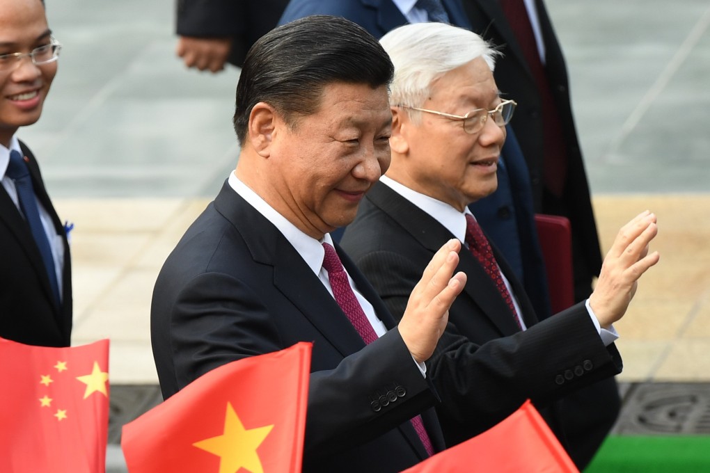 Chinese President Xi Jinping (C) and Vietnam's Communist Party Secretary General Nguyen Phu Trong (R). Photo: AFP