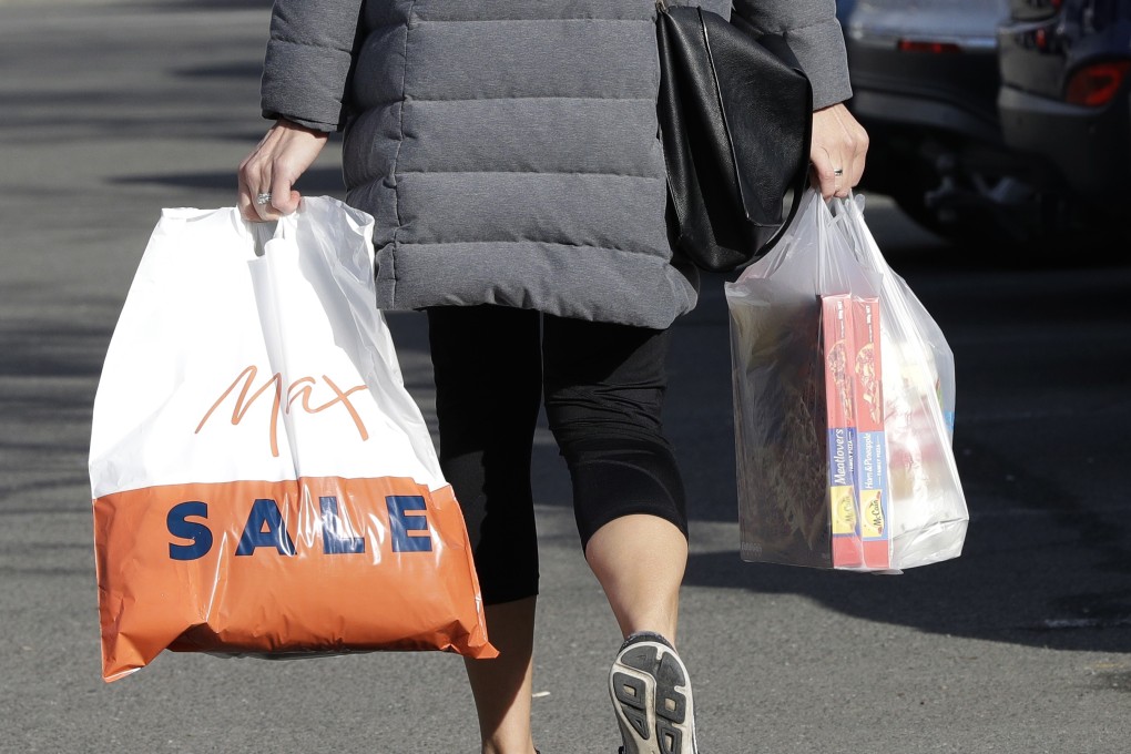 A shopper leaves a supermarket with goods in plastic bags. South Korea has introduced a ban on all plastic bags in supermarkets. Photo: AP