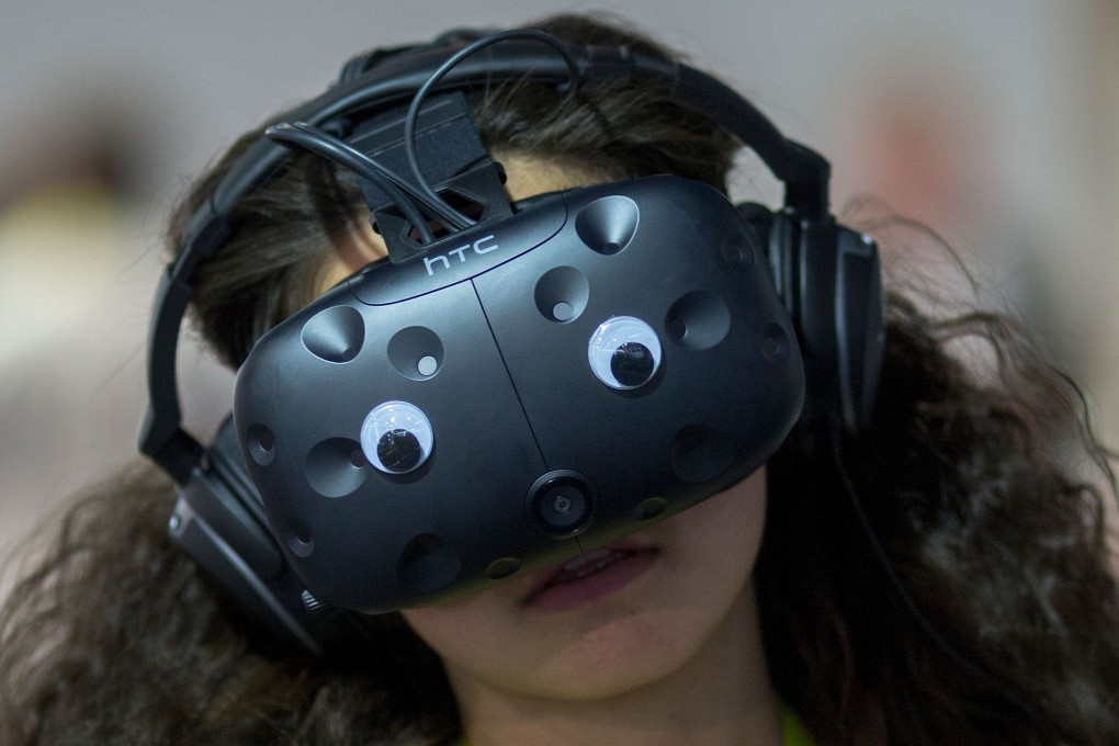 A woman wears a virtual reality simulator during the International Consumer Electronics Show in Las Vegas in 2017. To sustain the passion for inspiring and promoting the latest developments, we need to look to our schools, our universities and colleges to inspire the young. Photo: AFP