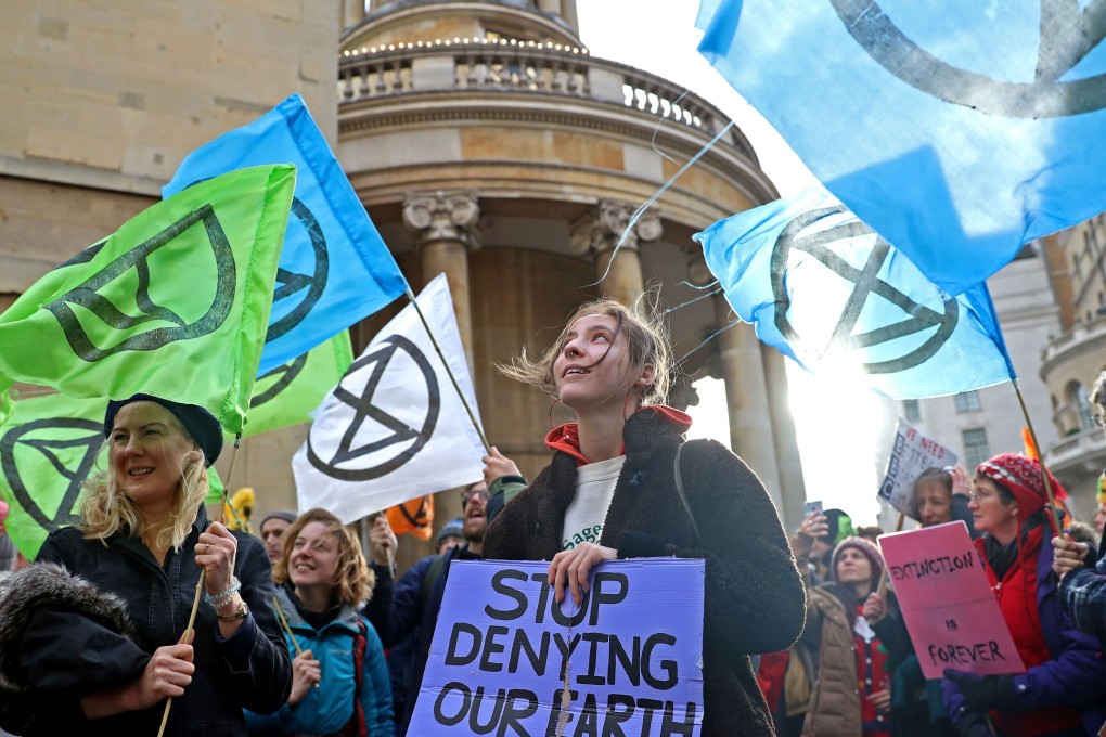 Protesters from the climate change pressure group Extinction Rebellion demonstrate outside the BBC offices in central London on December 21. They called on the broadcaster to give top priority to climate change and environmental issues, in both editorial coverage and corporate management. Photo: Reuters