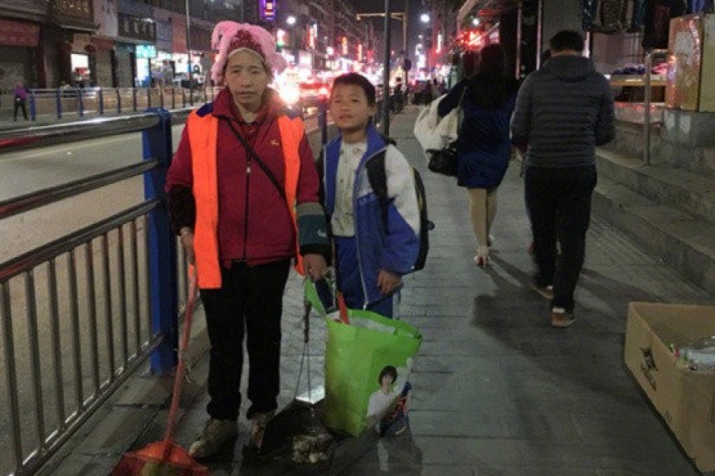Long Guotao started helping his mother, Wu Azhen, clean the streets in March. Photo: Weibo