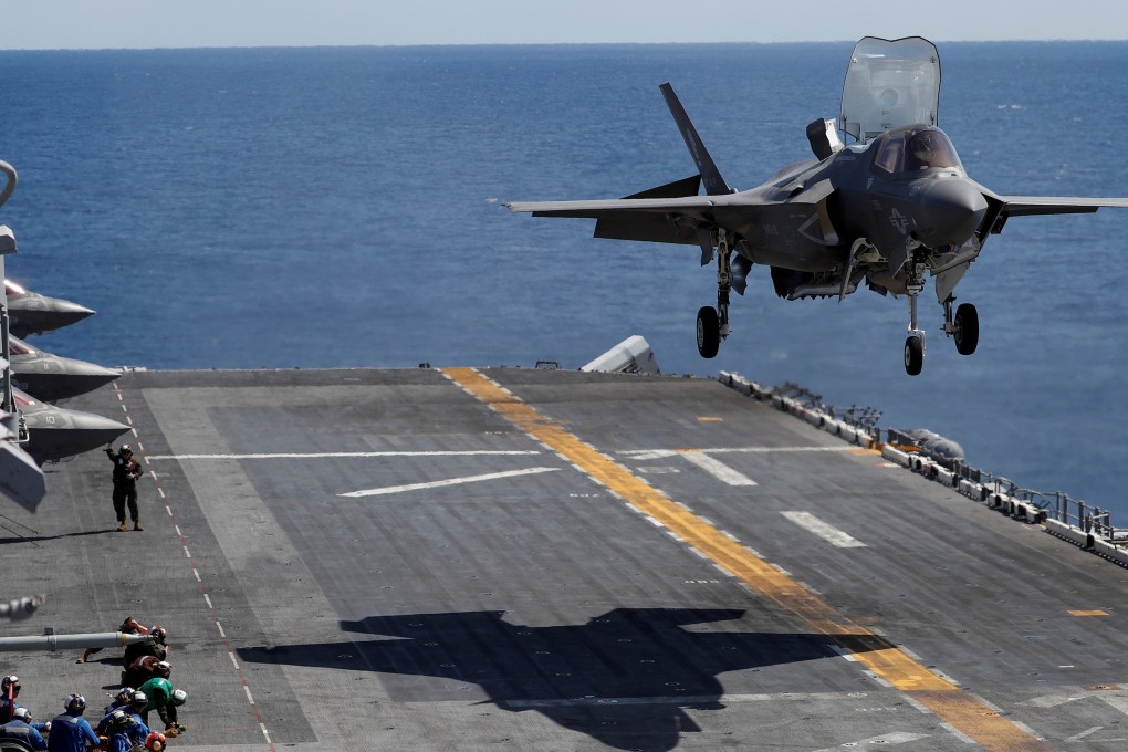 A Marine Corps pilot prepares for a vertical landing of Lockheed Martin F-35B stealth fighter aboard the USS Wasp amphibious assault carrier during their operation in the waters off Japan’s southernmost island of Okinawa. Photo: Reuters