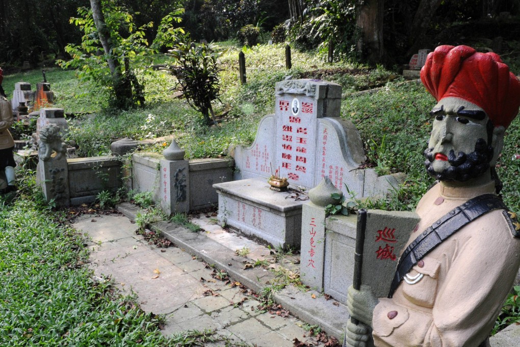 Statues of Sikh guards at Bukit Brown, one of Singapore’s oldest cemeteries. Photo: AFP