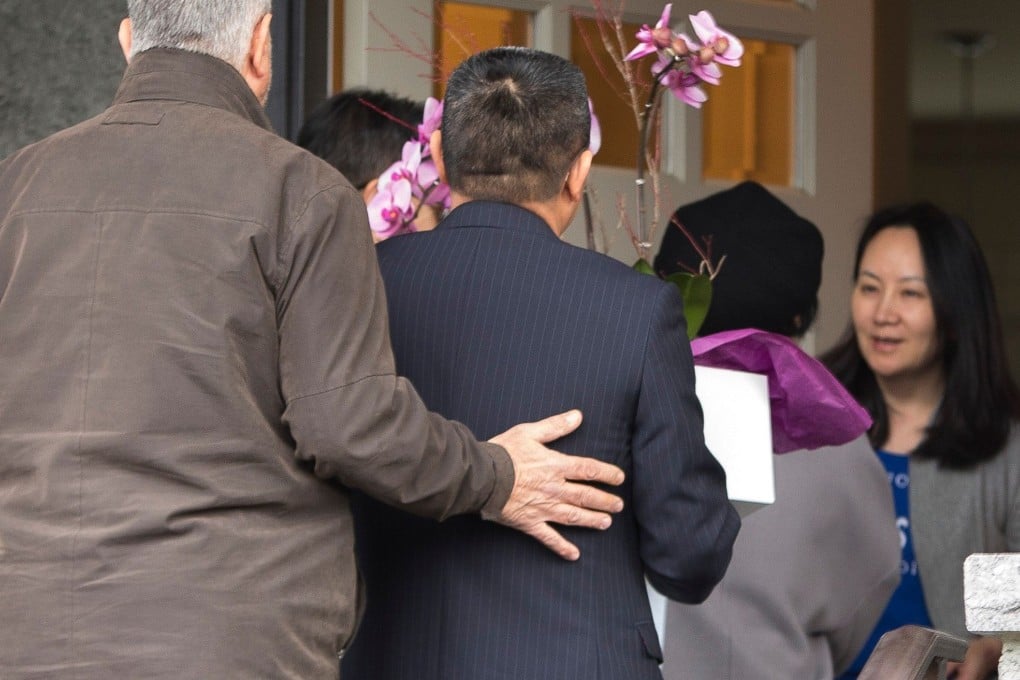 Huawei executive Meng Wanzhou answers the door after she is released on bail in Vancouver on December 12. Photo: AFP