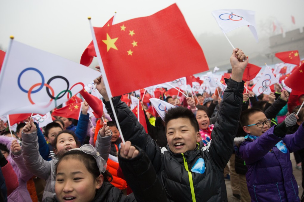 Chinese children in Beijing celebrate winning the right to host the 2022 Winter Olympics. Photo: EPA