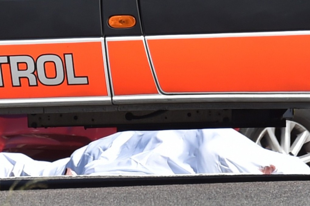 A body at the scene. Photo: EPA