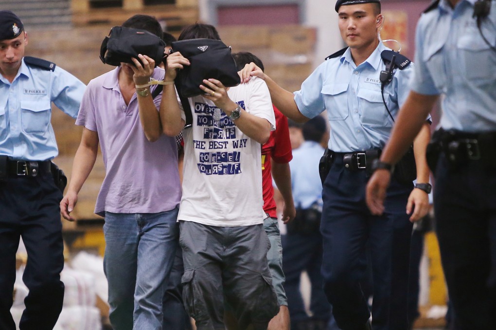 Police arrest mainland suspects believed to be illegally working in the city. Photo: David Wong