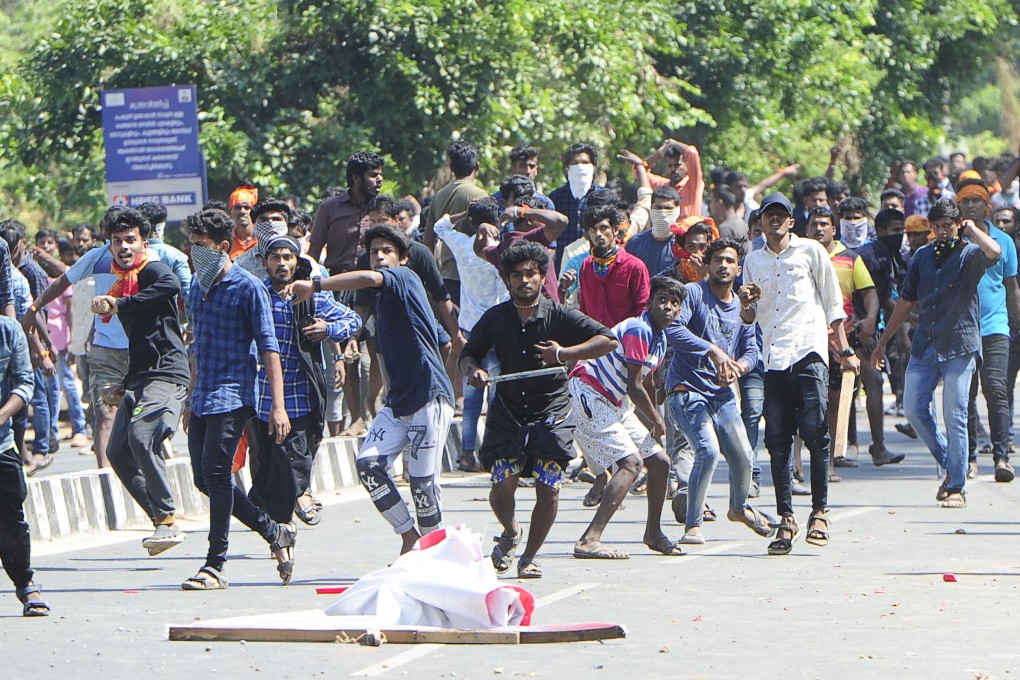 Indian protesters throw stones at police in clashes over Sabarimala temple. Photo: AFP