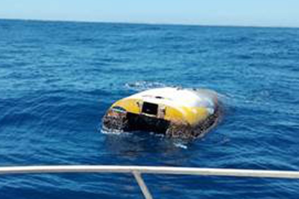 Californian Abby Sunderland’s boat is spotted after eight years at sea, covered in barnacles and semi-submerged. Photo: South Australia Police