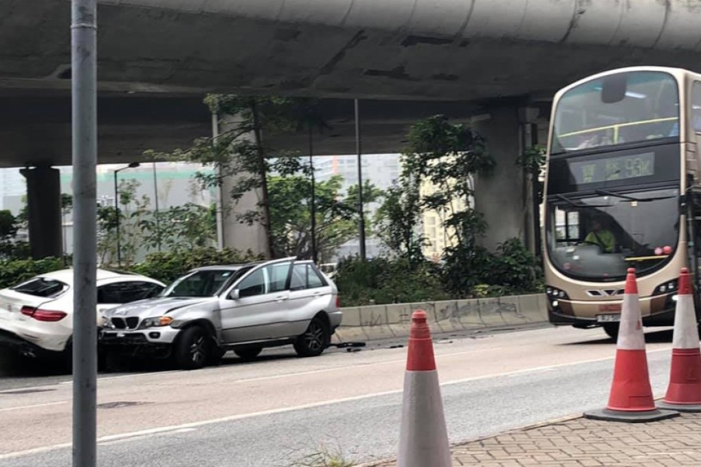 The victims’ white car is seen trapped against the concrete road divider by one of the attackers’ cars. Photo: Facebook