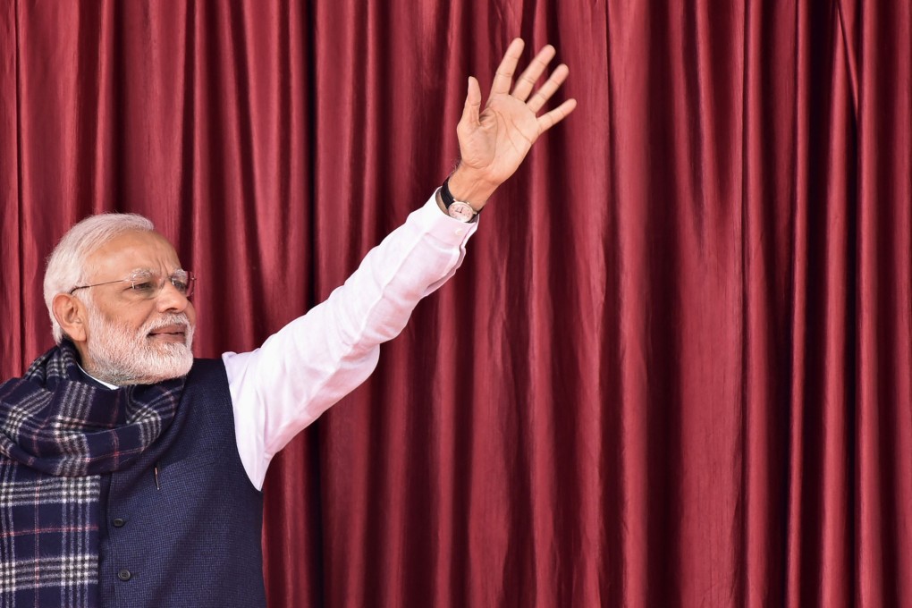 Indian Prime Minister Narendra Modi waves to a crowd as he arrives in Medininagar on January 5, 2019. Photo: AFP