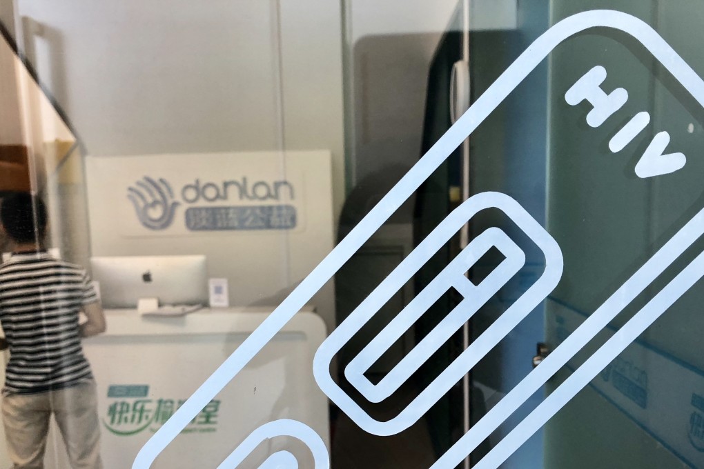 An employee looks through an appointment book at Danlan, Blued’s charity branch, which offers free walk-in HIV testing services to the public. 29MAY18 SCMP/Xinyan Yu