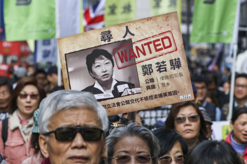 Protesters express discontent over Secretary for Justice Teresa Cheng’s handling of the C.Y. Leung-UGL payment case, as the annual New Year rally crosses Causeway Bay. Photo: Nora Tam