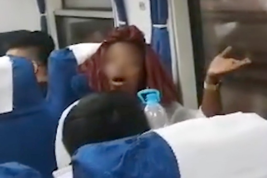 A woman on a train travelling from Shanghai to Fuyang in Anhui province apologised after bickering with her fellow passengers, throwing water and getting into a physical altercation after she was accused of taking someone else's seat. Photo: Thepaper