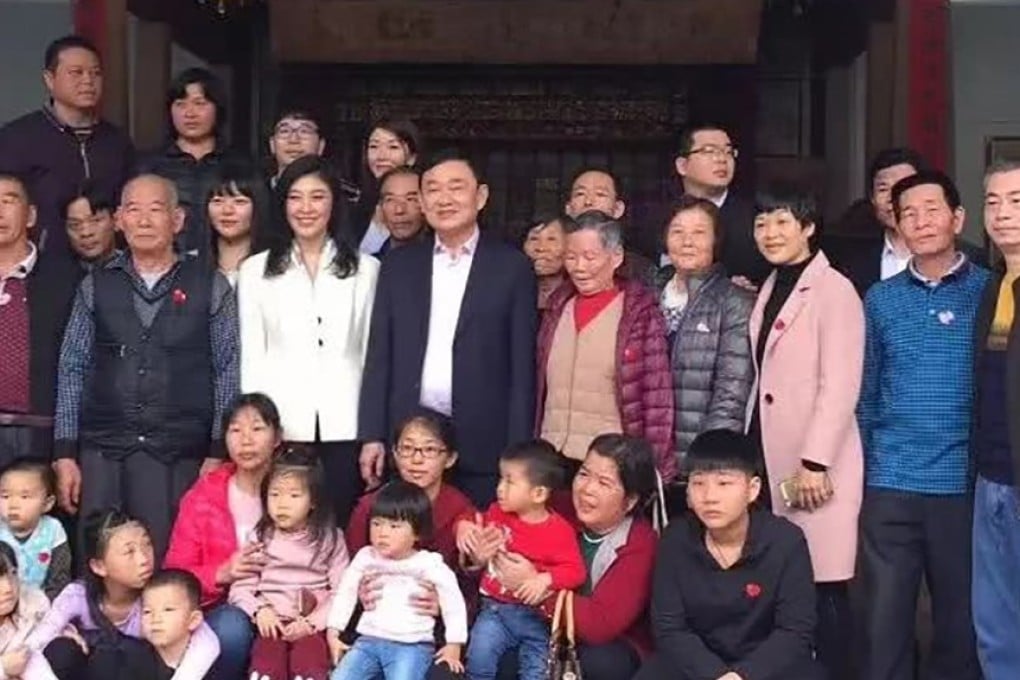 Exiled former Thai prime ministers Thaksin and Yingluck Shinawatra (middle row) visited their ancestors’ home in Guangdong province on Saturday. Photo: Handout